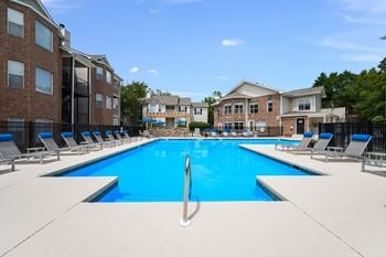 Outdoor resort-style swimming pool at Chace Lake Villas apartments for rent